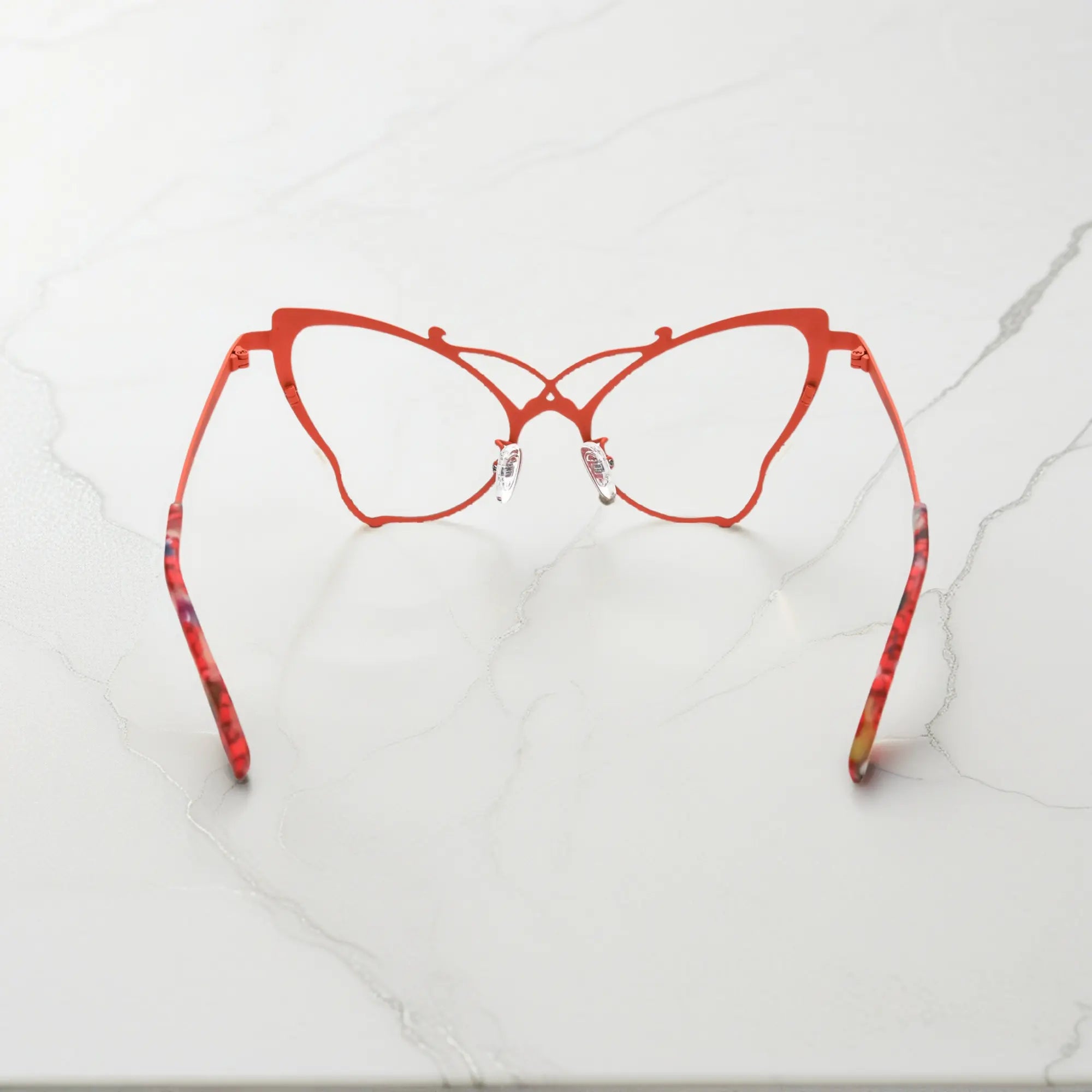 Back of VoyueLens™ VL185862 titanium butterfly eyeglasses in Amber Orange – a lightweight, colorful, vintage-inspired, prescription ready frame designed for unique artistic style and everyday comfort.